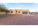 Tan stucco house with brown garage door, stone pathway, and gravel yard at 38913 N 21St Ave, Phoenix, AZ 85086