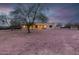 Back exterior of house with large yard and mature trees at 38913 N 21St Ave, Phoenix, AZ 85086