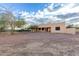 Back exterior of the house with a large backyard at 38913 N 21St Ave, Phoenix, AZ 85086
