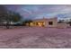 Back exterior view of house showcasing desert landscape at 38913 N 21St Ave, Phoenix, AZ 85086