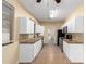 Kitchen with white cabinets, granite countertops, and stainless steel appliances at 38913 N 21St Ave, Phoenix, AZ 85086