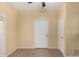 Laundry room with built-in shelving and tile flooring at 38913 N 21St Ave, Phoenix, AZ 85086