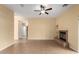 Living room with tile floors, fireplace, and built-in shelving at 38913 N 21St Ave, Phoenix, AZ 85086