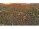 Aerial view of a desert lot with mountain views and a foundation at 42418 N Sierra Vista 1 Dr, Cave Creek, AZ 85331