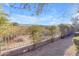 Neatly maintained backyard with a metal fence and gravel at 4529 E Coyote Wash Dr, Cave Creek, AZ 85331