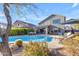 Inviting backyard with sparkling pool, patio furniture, and lush landscaping at 4529 E Coyote Wash Dr, Cave Creek, AZ 85331