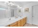 Elegant bathroom with double sinks and updated light fixtures at 4529 E Coyote Wash Dr, Cave Creek, AZ 85331