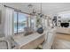 Dining room with a wooden table, beige chairs, and pool view at 4529 E Coyote Wash Dr, Cave Creek, AZ 85331
