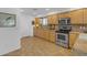 Kitchen with light wood cabinets, tile floors, and stainless steel appliances at 4529 E Coyote Wash Dr, Cave Creek, AZ 85331