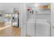 Convenient laundry room with washer, dryer, and shelving at 4529 E Coyote Wash Dr, Cave Creek, AZ 85331