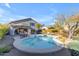 Kidney shaped pool with patio furniture and landscaping at 4529 E Coyote Wash Dr, Cave Creek, AZ 85331