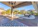 Covered patio with chandelier offering pool and landscape views at 4529 E Coyote Wash Dr, Cave Creek, AZ 85331