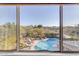 Scenic pool view from a window, showcasing backyard oasis at 4529 E Coyote Wash Dr, Cave Creek, AZ 85331