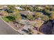 An aerial view of a single-story home with a pool and large backyard, situated on a quiet street at 4605 E Orange Dr, Phoenix, AZ 85018
