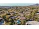 Aerial view of single-level home with pool, showcasing surrounding landscape and distant mountain views at 4605 E Orange Dr, Phoenix, AZ 85018