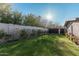 Landscaped backyard with lush lawn and gated access at 4605 E Orange Dr, Phoenix, AZ 85018