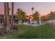 Stunning backyard featuring a sparkling pool, lush landscaping, and lounge chairs with mountain views at 4605 E Orange Dr, Phoenix, AZ 85018