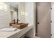 Elegant bathroom with modern vessel sink and marble tile at 4605 E Orange Dr, Phoenix, AZ 85018