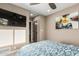 Serene bedroom with TV and wall art at 4605 E Orange Dr, Phoenix, AZ 85018