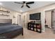 Spacious bedroom with large TV and ample storage at 4605 E Orange Dr, Phoenix, AZ 85018