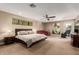 Spacious main bedroom with large bed and sitting area at 4605 E Orange Dr, Phoenix, AZ 85018
