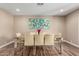 Modern dining room with wood table and light-beige chairs at 4605 E Orange Dr, Phoenix, AZ 85018