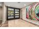Bright entryway with modern glass doors and large artwork at 4605 E Orange Dr, Phoenix, AZ 85018