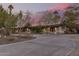 Home exterior at dusk with circular driveway at 4605 E Orange Dr, Phoenix, AZ 85018