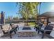 Backyard fire pit with seating and a view of the pool at 4605 E Orange Dr, Phoenix, AZ 85018