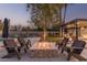 Relaxing fire pit area with comfortable seating and lush landscaping at 4605 E Orange Dr, Phoenix, AZ 85018