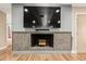 Modern fireplace with a contemporary tile surround at 4605 E Orange Dr, Phoenix, AZ 85018
