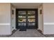 Modern front door with glass panels, leading to a bright foyer at 4605 E Orange Dr, Phoenix, AZ 85018