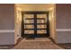 Modern glass front door with sleek black frame at 4605 E Orange Dr, Phoenix, AZ 85018