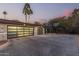 Spacious two-car garage with modern glass doors and a basketball court at 4605 E Orange Dr, Phoenix, AZ 85018