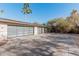 Two-car garage with modern glass doors and basketball court at 4605 E Orange Dr, Phoenix, AZ 85018