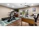 Modern home gym featuring exercise equipment and hardwood floors at 4605 E Orange Dr, Phoenix, AZ 85018