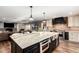 Updated kitchen with granite island, stainless steel appliances, and custom cabinetry at 4605 E Orange Dr, Phoenix, AZ 85018