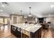 Large kitchen island with granite countertops and wine cooler at 4605 E Orange Dr, Phoenix, AZ 85018