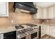 Kitchen with stainless steel range and custom cabinetry at 4605 E Orange Dr, Phoenix, AZ 85018