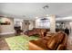 Living room with leather sofas, wood floors and modern art at 4605 E Orange Dr, Phoenix, AZ 85018