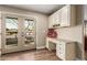 Built-in office area with granite countertop and patio access at 4605 E Orange Dr, Phoenix, AZ 85018