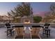 Relaxing patio area with a fire pit and comfortable seating at 4605 E Orange Dr, Phoenix, AZ 85018