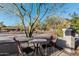Small patio with table and chairs, offering a view of the street at 4605 E Orange Dr, Phoenix, AZ 85018