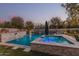 Inviting pool and spa with a water feature and lounge chairs at 4605 E Orange Dr, Phoenix, AZ 85018