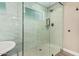 Spacious walk-in shower with marble tile and geometric accents at 4605 E Orange Dr, Phoenix, AZ 85018