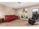 Relaxing sitting area with comfortable seating and large art at 4605 E Orange Dr, Phoenix, AZ 85018