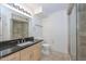 Spa-like bathroom with walk-in shower and dark countertop at 4808 N 24Th St # 1123, Phoenix, AZ 85016