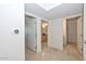 Bright hallway with doors to bedrooms and bathrooms at 4808 N 24Th St # 1123, Phoenix, AZ 85016