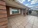 Covered patio with tile flooring and brick exterior at 5125 E Emelita Cir, Mesa, AZ 85206