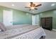 Bedroom with green walls, ceiling fan, and ample closet space at 5781 W Ross Dr, Chandler, AZ 85226